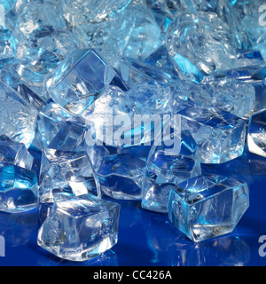 studio photography of blue illuminated ice cubes in dark back Stock Photo