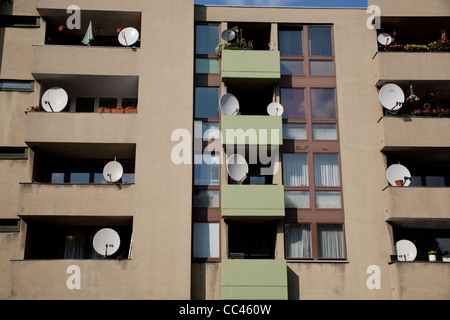 Satellite dishes on an apartment block Stock Photo