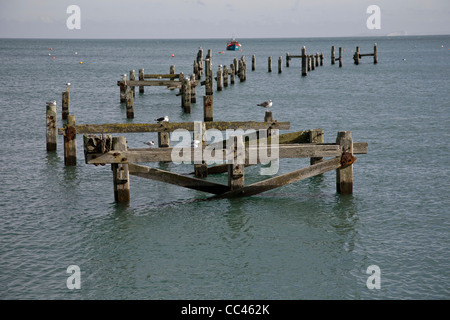 The rotting remains of the old pier at Swanage Dorset Stock Photo