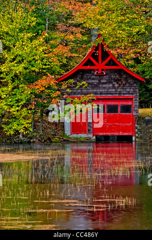 USA, New York, Old Forge. Red boathouse on lake shore. Credit as: Jay O'Brien / Jaynes Gallery / DanitaDelimont.com Stock Photo