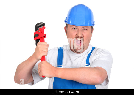 Workman in dungarees with calliper Stock Photo