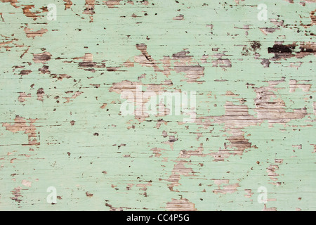 Flaking Green Paint on Faded Wood Background Stock Photo