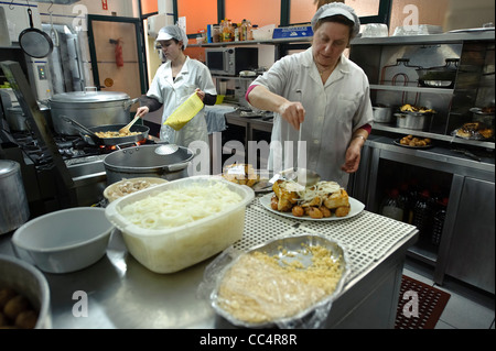 Chefs preparing food in restaurant's modern professional kitchen Stock Photo