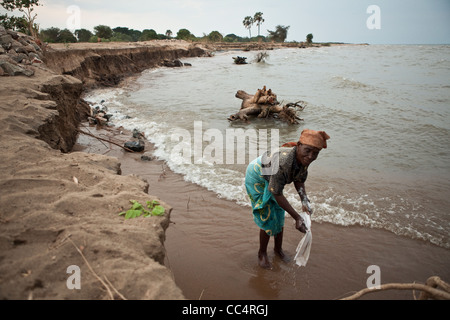 Locals washing in Lake Malawi at Karonga - Southern Africa. Stock Photo