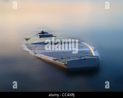 sinking boat in the fog Stock Photo