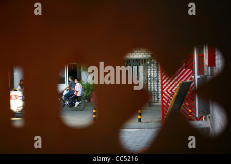 Looking outside through lattice window, Fangjia Hutong, Beijing, China Stock Photo