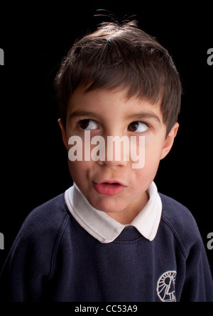Boy looking away, studio shot Stock Photo
