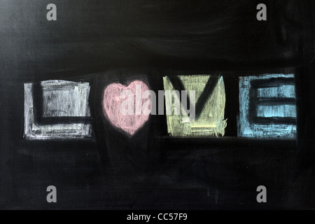 Chalk drawing - Love word written on chalkboard Stock Photo