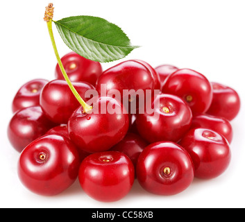 Perfect sweet cherries with the leaf isolated on a white background. Stock Photo