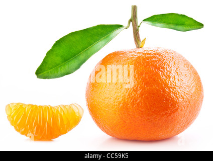 Tangerine with leaves and its slice on white background. Stock Photo