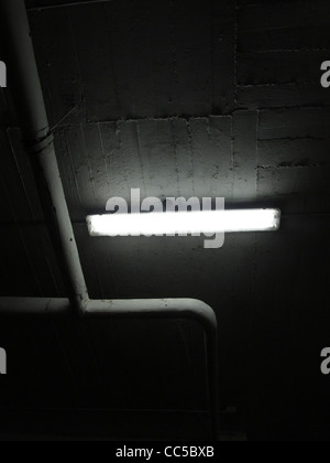 strip light in dark alley passage tunnel at night Stock Photo