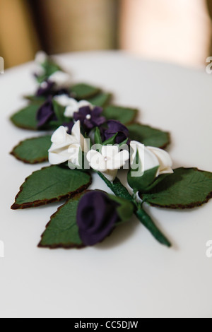 floral decoration on top of of a wedding cake Stock Photo