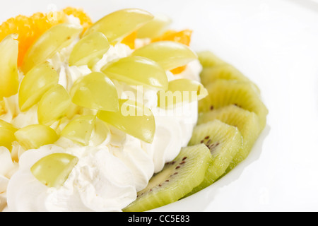 Ice cream dessert with kiwi and orange decorated with butterfly Stock ...