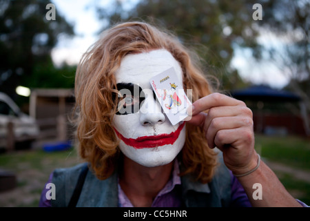A man dressed up as 'The Joker' for a fancy dress Halloween party. Stock Photo