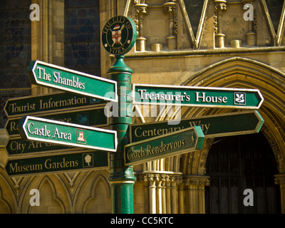 Signpost with signs to York’s tourist attractions in front of York Minster. Stock Photo