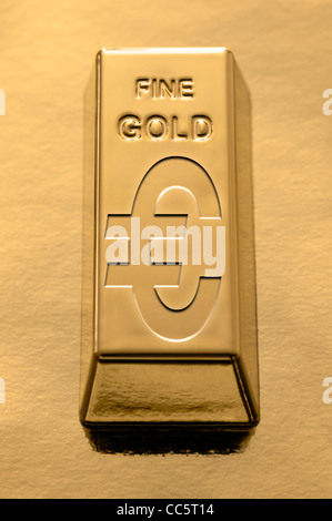 Gold Bar with a Euro symbol embossed on it on a gold background Stock Photo