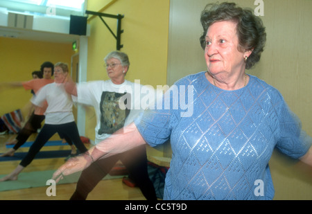 Over 50s yoga class in progress, Peckham Pulse Leisure Centre, Peckham, Southwark, London, UK. Stock Photo