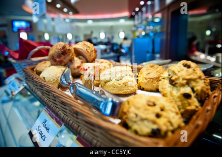 Traditional scones on display in food hall Stock Photo