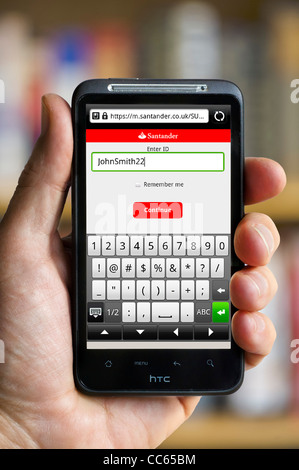Mobile banking with Santander on an HTC smartphone Stock Photo