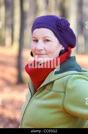 Portrait of an attractive 50 year old woman spending time outdoors. Stock Photo