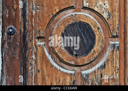 Old wooden doors detail with door bell switch, Slight grain visible Stock Photo