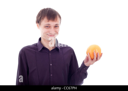 Man wry face grimace holding sour fruit, isolate on white background. Stock Photo