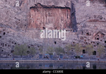 Rocky moutain carved with Buddha statues and lots of caves, Longmen Grottoes, Luoyang, Henan , China Stock Photo