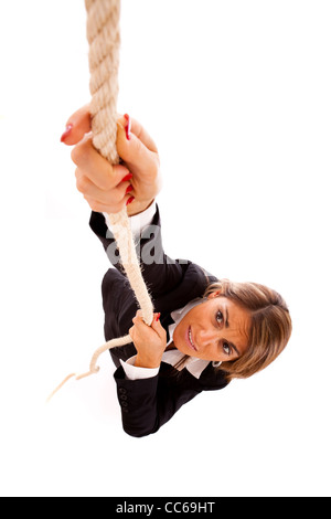 businesswoman climbing up a rope (isolated on white) Stock Photo