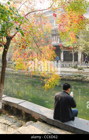 Man sitting beside the river, Ling Canal, Guilin, Guangxi , China