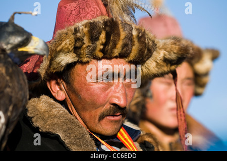 Kazakh eagle hunters in the Altai mountains region of western Mongolia. Stock Photo