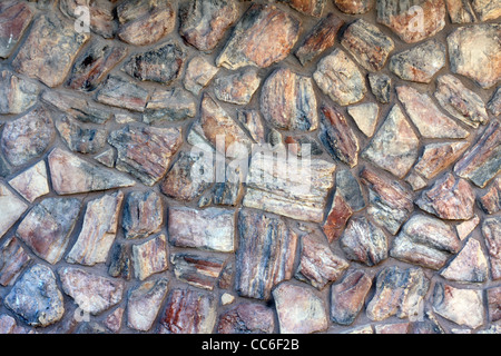 cobblestone wall with natural stone rock veneer Stock Photo