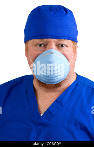 Surgeon in blue scrubs wears a surgical mask to prevent the spread of germs. Stock Photo