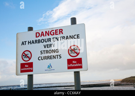 Danger sign warning of strong currents Stock Photo