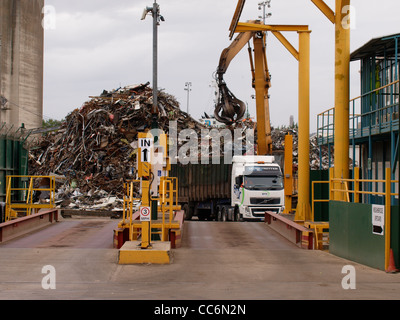 Orange peel grab of dock crane grabbing recycled scrap metal at ...