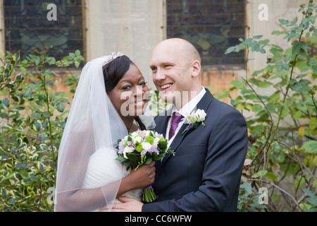 Multi Racial bride and groom. Rugby, Warwickshire, England, UK Stock Photo