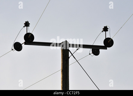 Overhead low voltage electrical power line on wooden pole. Scout Scar, Kendal, Cumbria, England, United Kingdom, Europe. Stock Photo