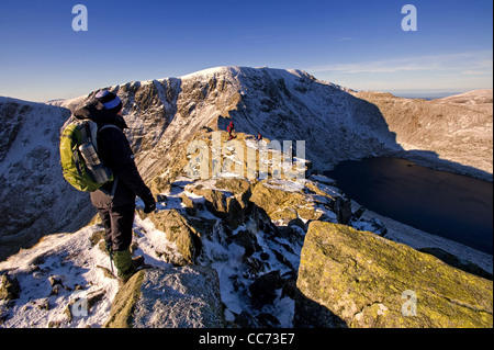 Walker on Striding Edge, Helvellyn in Lake District Stock Photo