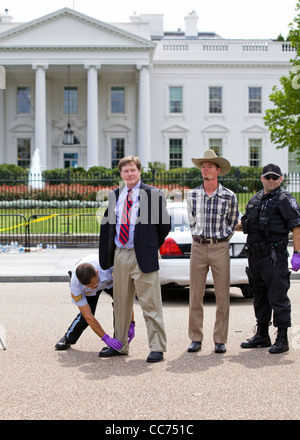 Detained demonstrator getting frisked for processing in front of the White House Stock Photo