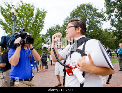 Protester speaking through a bullhorn Stock Photo