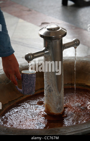 Czech Republic, Karlovy Vary. View of traditional style drinking cup to collect hot spring water from spring fountain Stock Photo