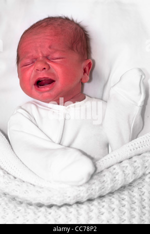 Crying baby with red face Stock Photo - Alamy