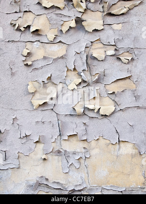 Detail of flaking and peeling paint on a wall Stock Photo