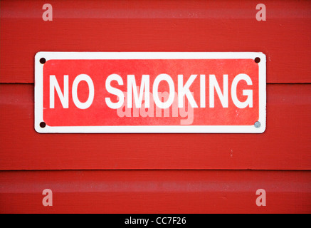 no smoking sign mounted on wall Stock Photo