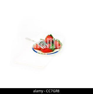 fresh strawberries on little dish isolated over white Stock Photo