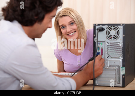 Technician installing a hard drive Stock Photo