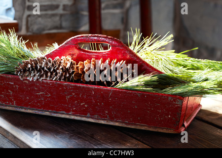 Pine Cones and Pine Needles in Wooden Trug Stock Photo