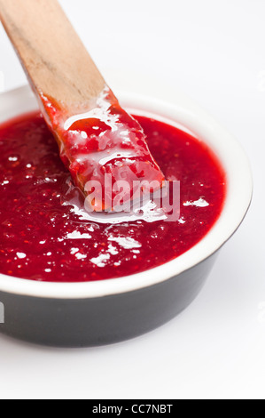 Bowl filled with strawberry jam Stock Photo