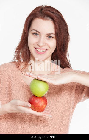 Young woman holding two apples Stock Photo