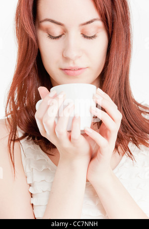 Young woman holding a white cup Stock Photo