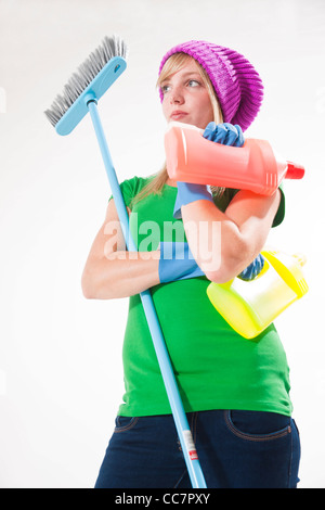 Portrait of Young Woman with Cleaning Supplies Stock Photo